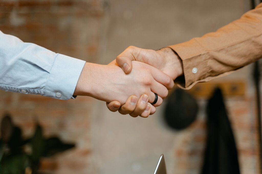 pexels-photo-7255731-7255731 Close-up of a firm handshake symbolizing a business deal agreement.